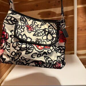 Authentic Coach shoulder bag (roomy medium size) with a white background